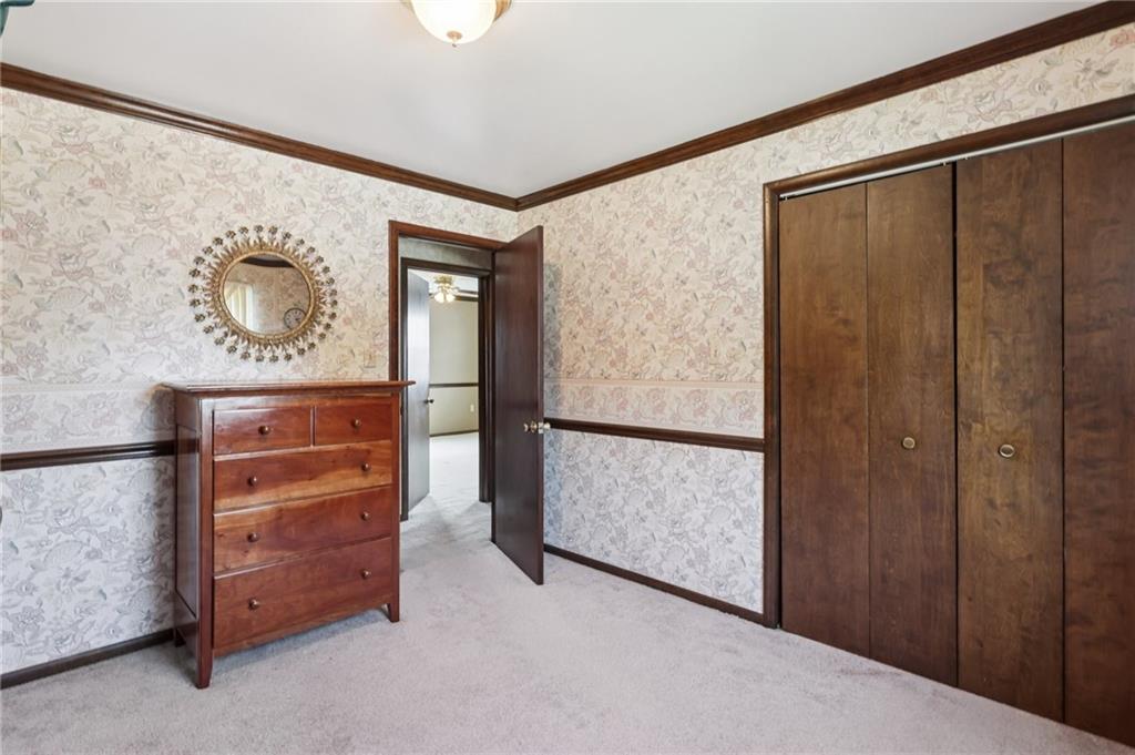 948 9th Street New Castle, PA 16101 - Photo 16 of 31 a bedroom with a bed and a dresser