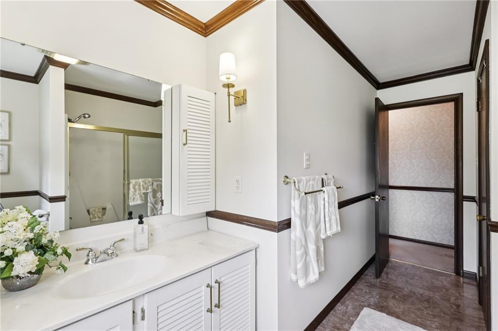 948 9th Street New Castle, PA 16101 - Photo 17 of 31 a bathroom with a sink and mirror