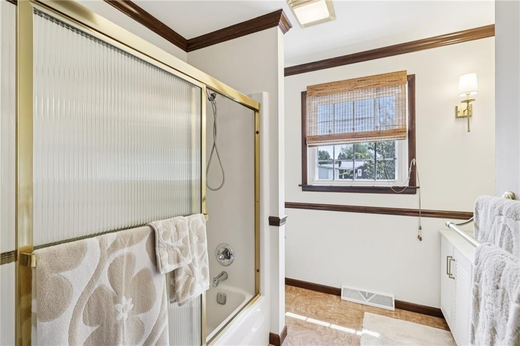 948 9th Street New Castle, PA 16101 - Photo 18 of 31 a bathroom with a bathtub and a shower