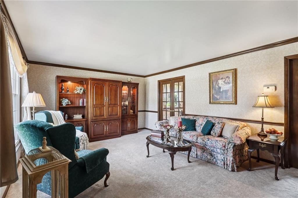 948 9th Street New Castle, PA 16101 - Photo 7 of 31 a living room with furniture and a lamp