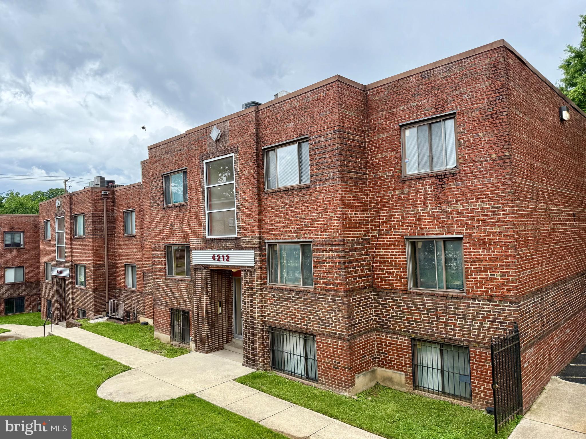 4212 Benning Road Northeast, Unit 6 Washington, DC 20019 - Photo 2 of 21 a brick building that has a lots of windows in it