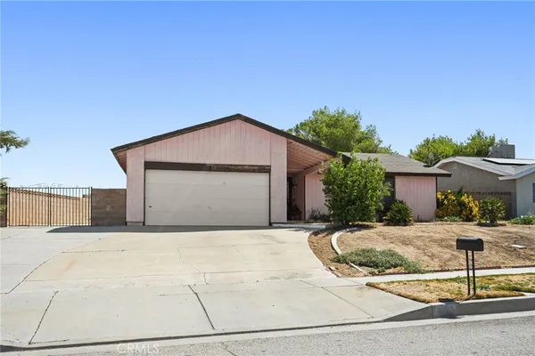 a front view of a house with yard