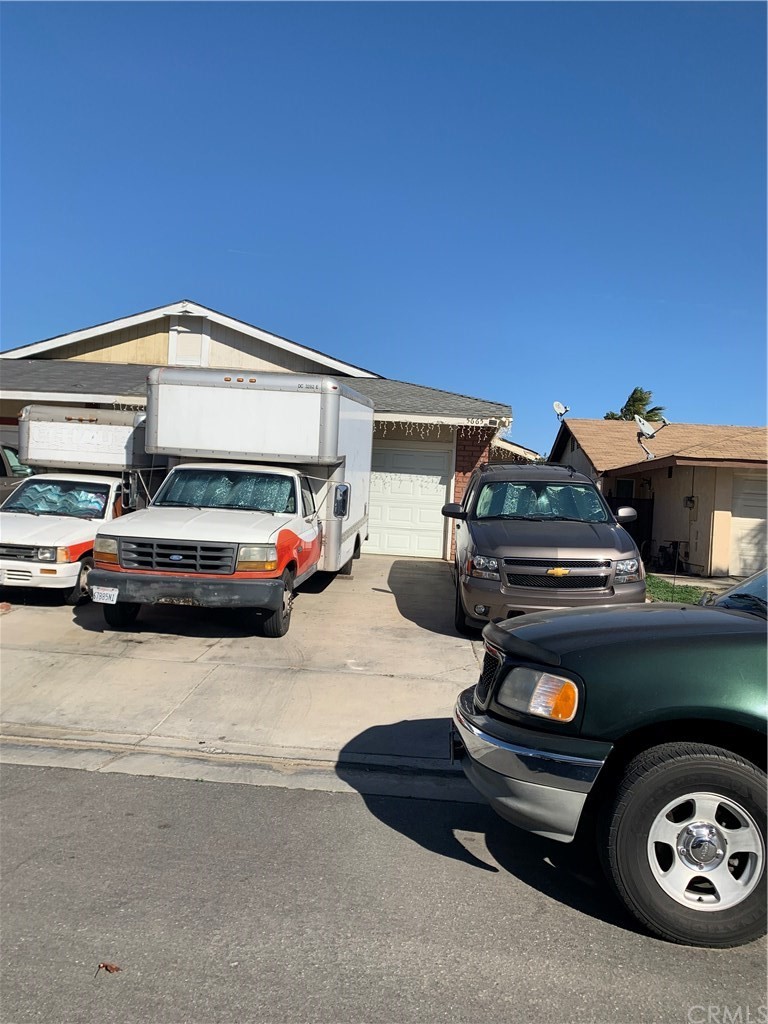 5665 Sexton Lane Riverside, CA 92509 - Photo 1 of 1 a car parked in front of a house