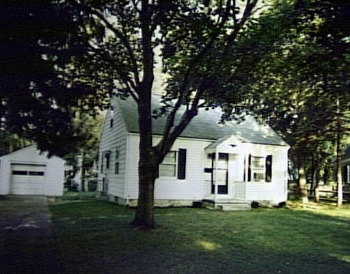 148 Mayflower Road Springfield, MA 01118 - Photo 1 of 1 a view of a yard in front of a house with a large tree