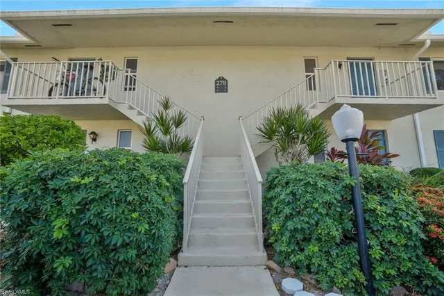 a view of entryway with flower pots