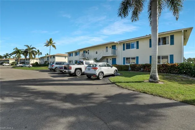a view of a parked cars in front of a house