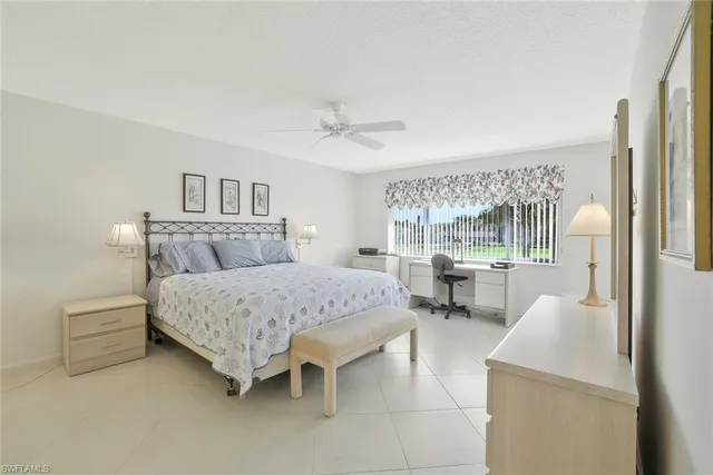 a bedroom with a bed and a table