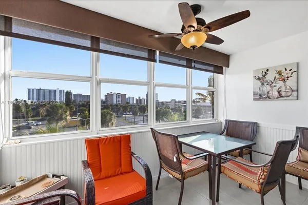 a dining room with furniture and window