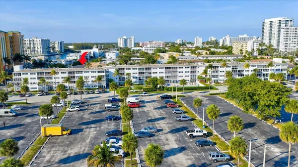 a view of gym equipment and many windows