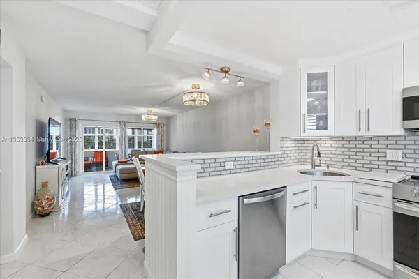 a kitchen with a sink and cabinets