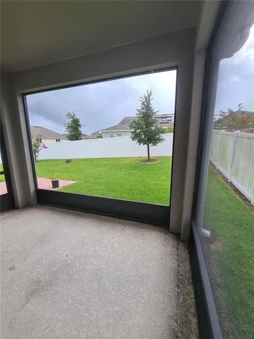 a view of a back yard from a balcony