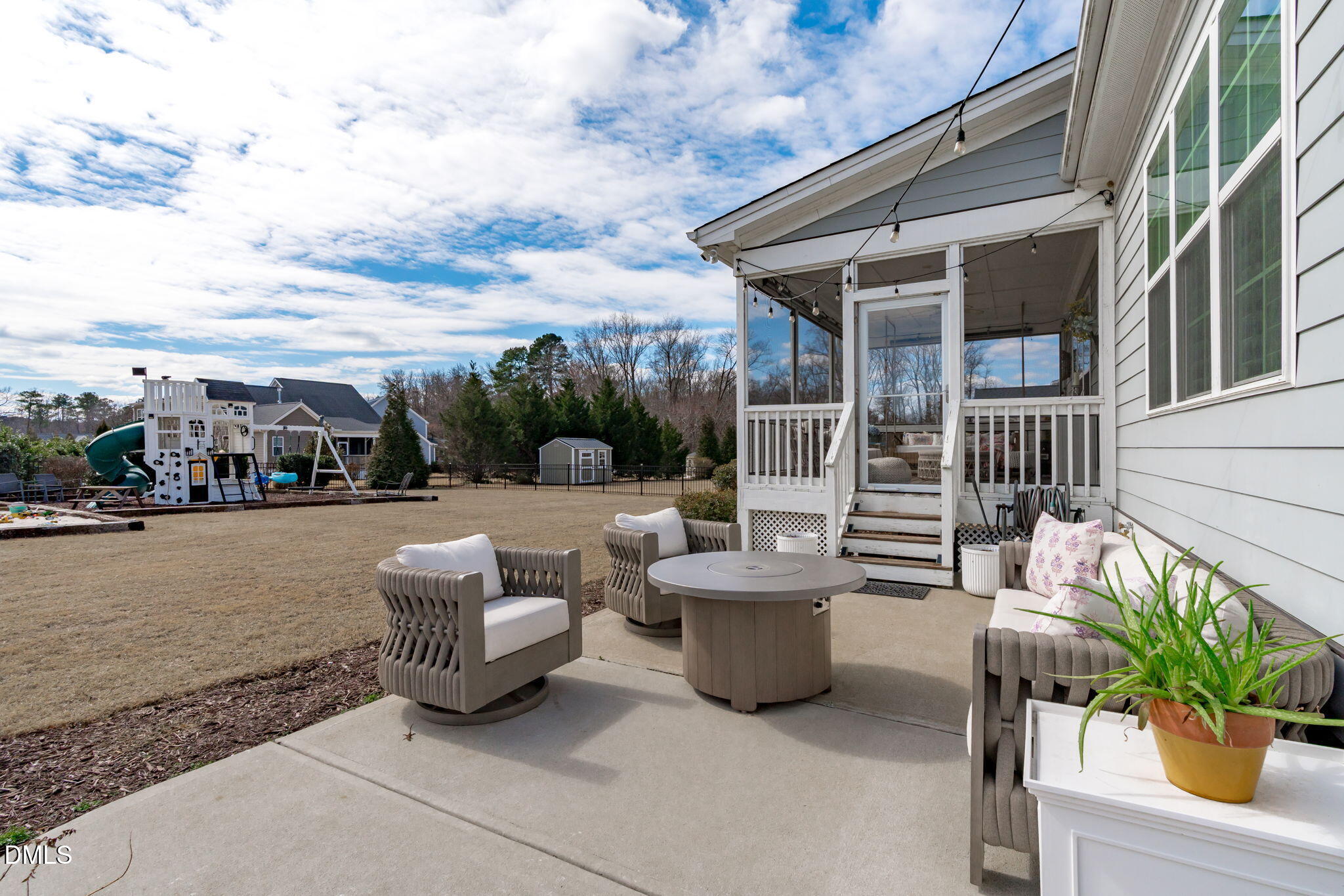4144 Olde Judd Drive Willow Spring, NC 27592 - Photo 36 of 52 a view of a patio with couches chairs and potted plants
