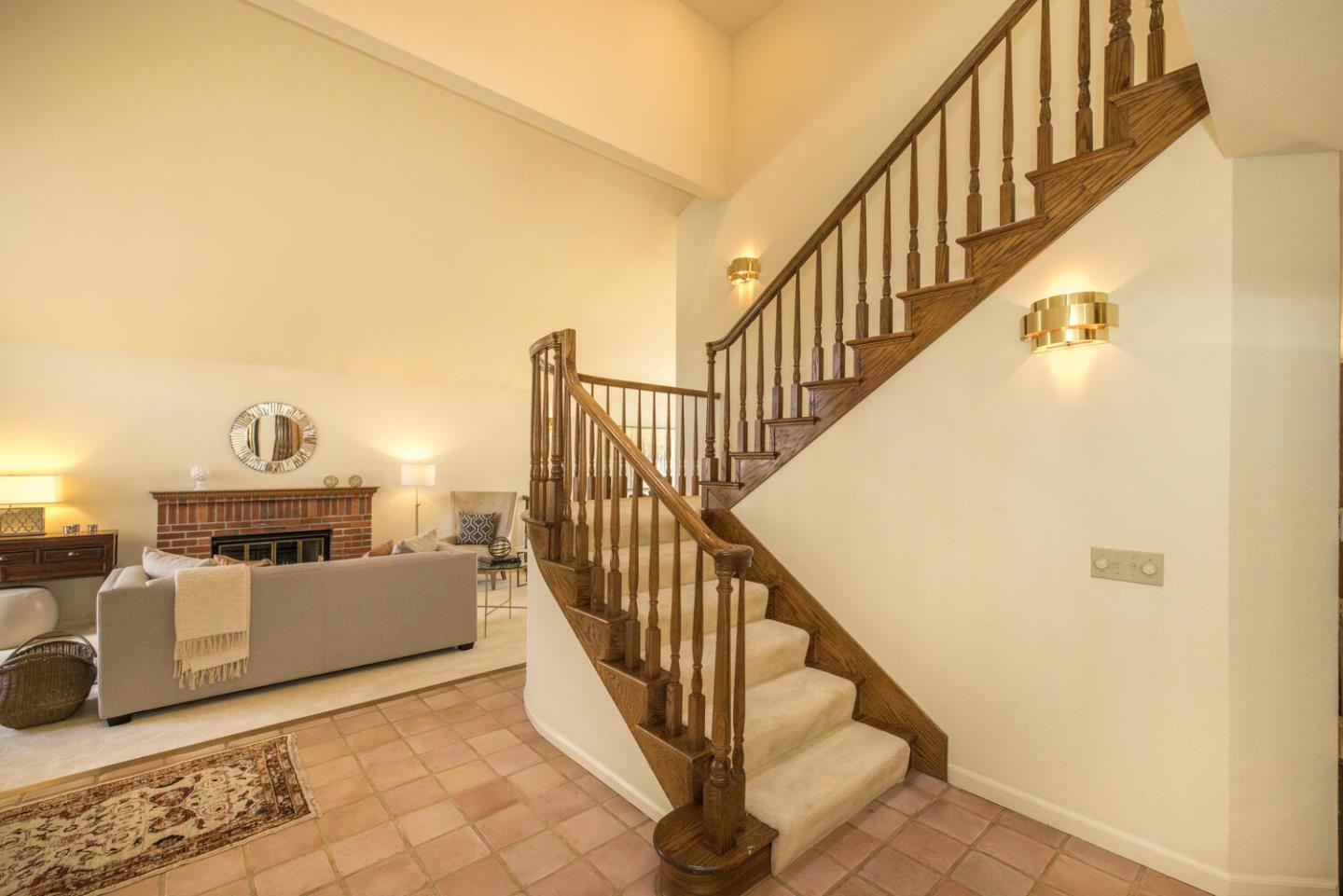 138 Cypress Point Road Half Moon Bay, CA 94019 - Photo 13 of 64 a view of a livingroom with wooden floor and stairs