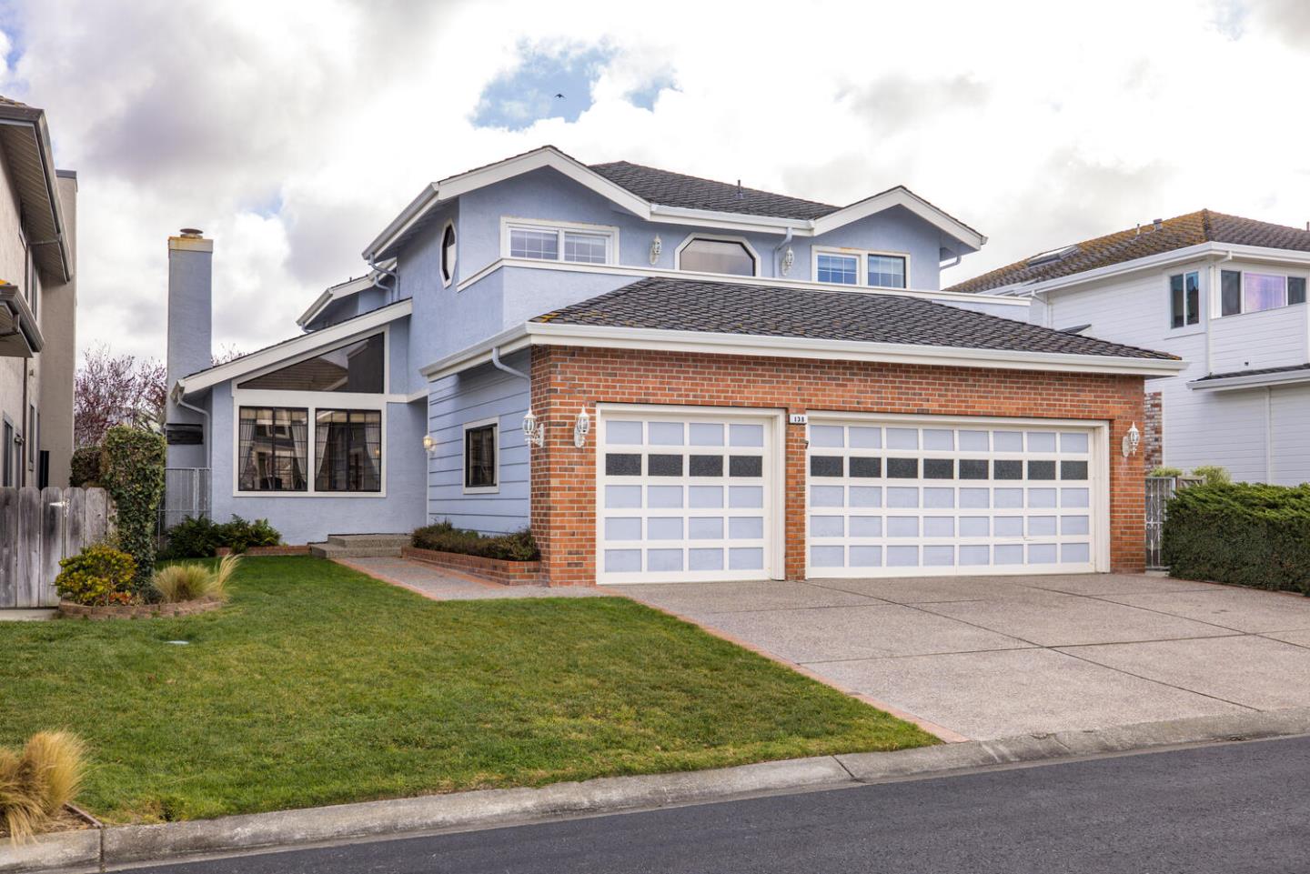 138 Cypress Point Road Half Moon Bay, CA 94019 - Photo 2 of 64 a front view of a house with a garden and yard
