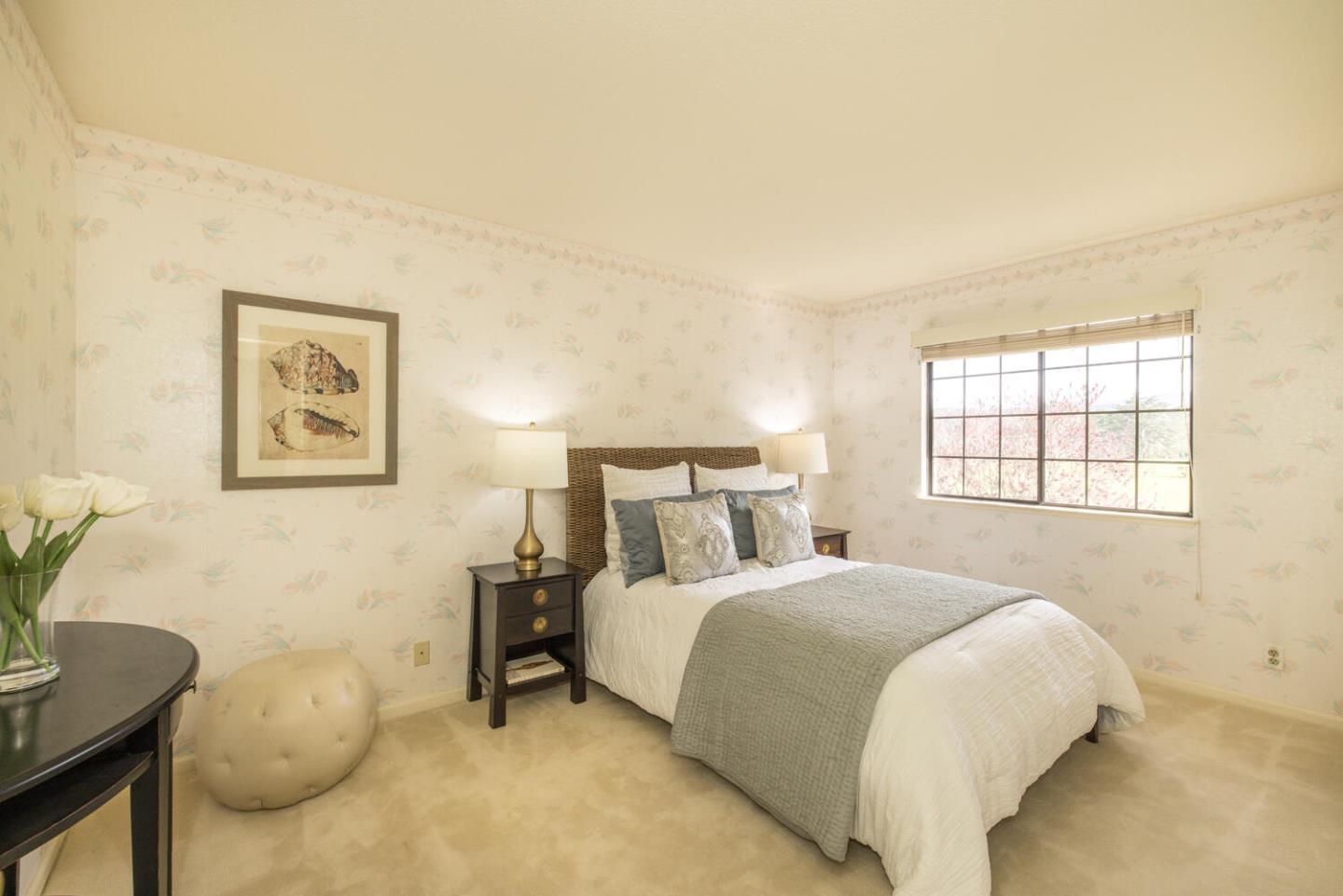 138 Cypress Point Road Half Moon Bay, CA 94019 - Photo 25 of 64 a bedroom with a bed and a window