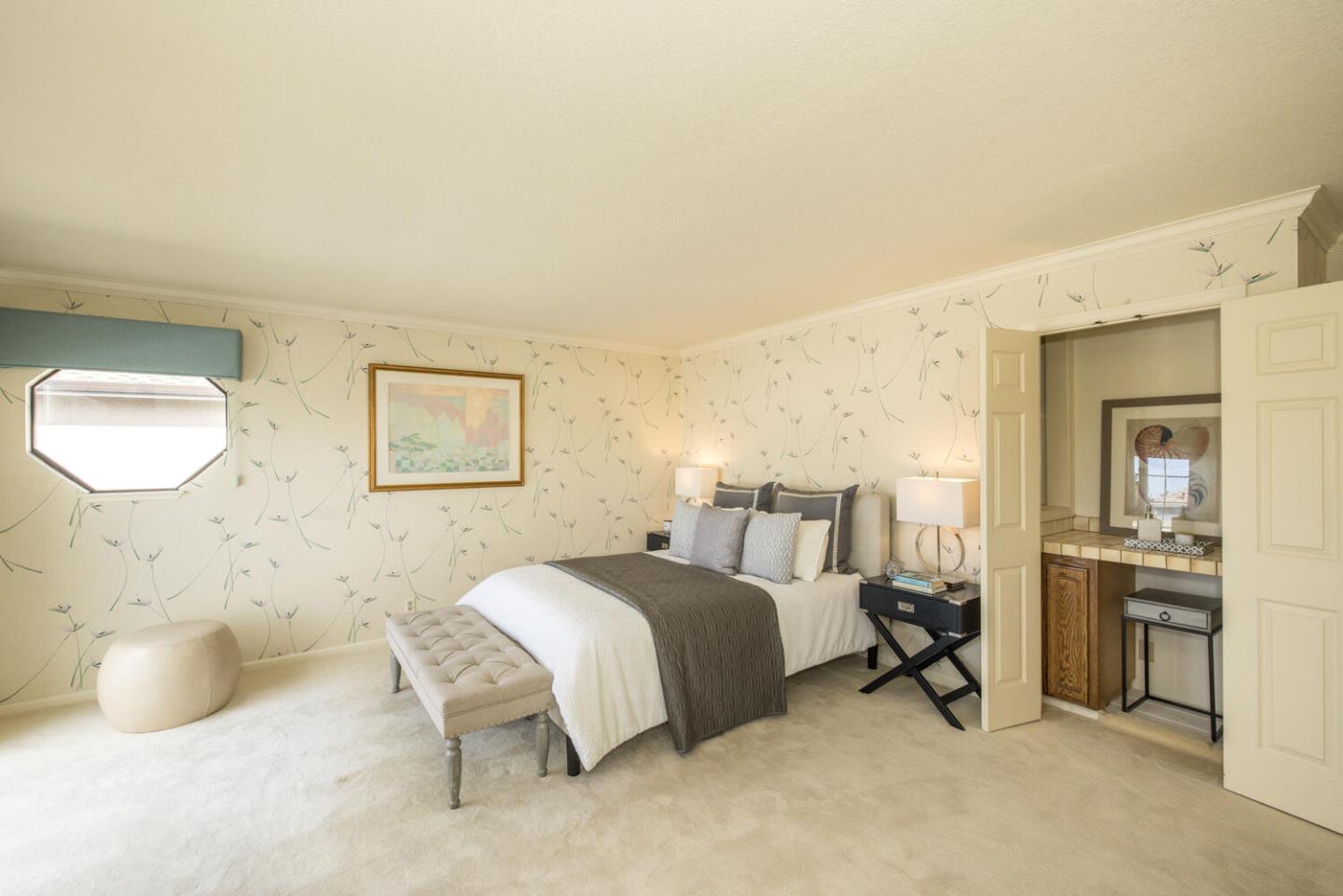 138 Cypress Point Road Half Moon Bay, CA 94019 - Photo 29 of 64 a bedroom with a bed and a cabinets