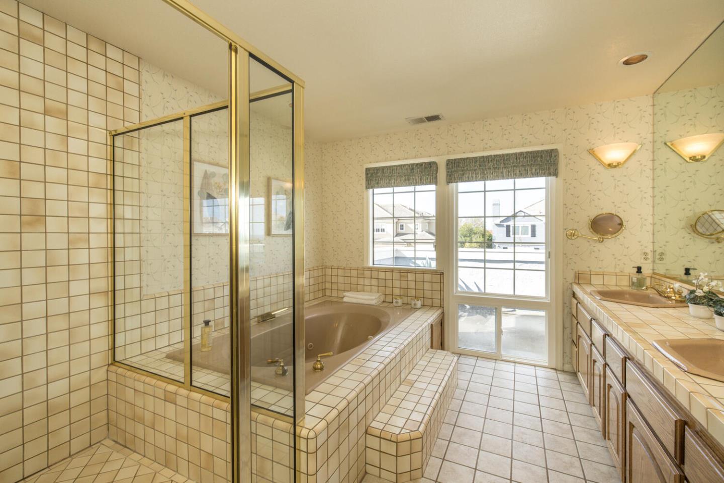 138 Cypress Point Road Half Moon Bay, CA 94019 - Photo 31 of 64 a spacious bathroom with a granite countertop tub sink and shower