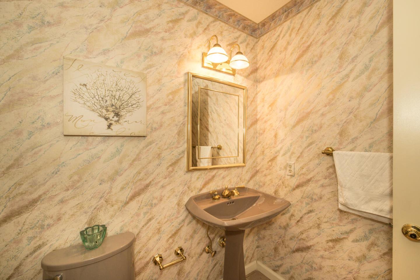 138 Cypress Point Road Half Moon Bay, CA 94019 - Photo 36 of 64 a bathroom with a sink and mirror