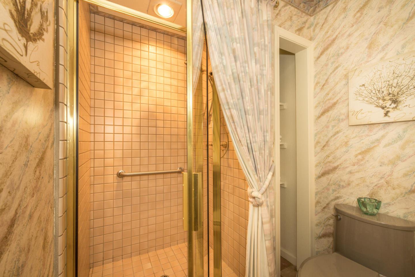 138 Cypress Point Road Half Moon Bay, CA 94019 - Photo 37 of 64 a bathroom with a shower curtain and a sink