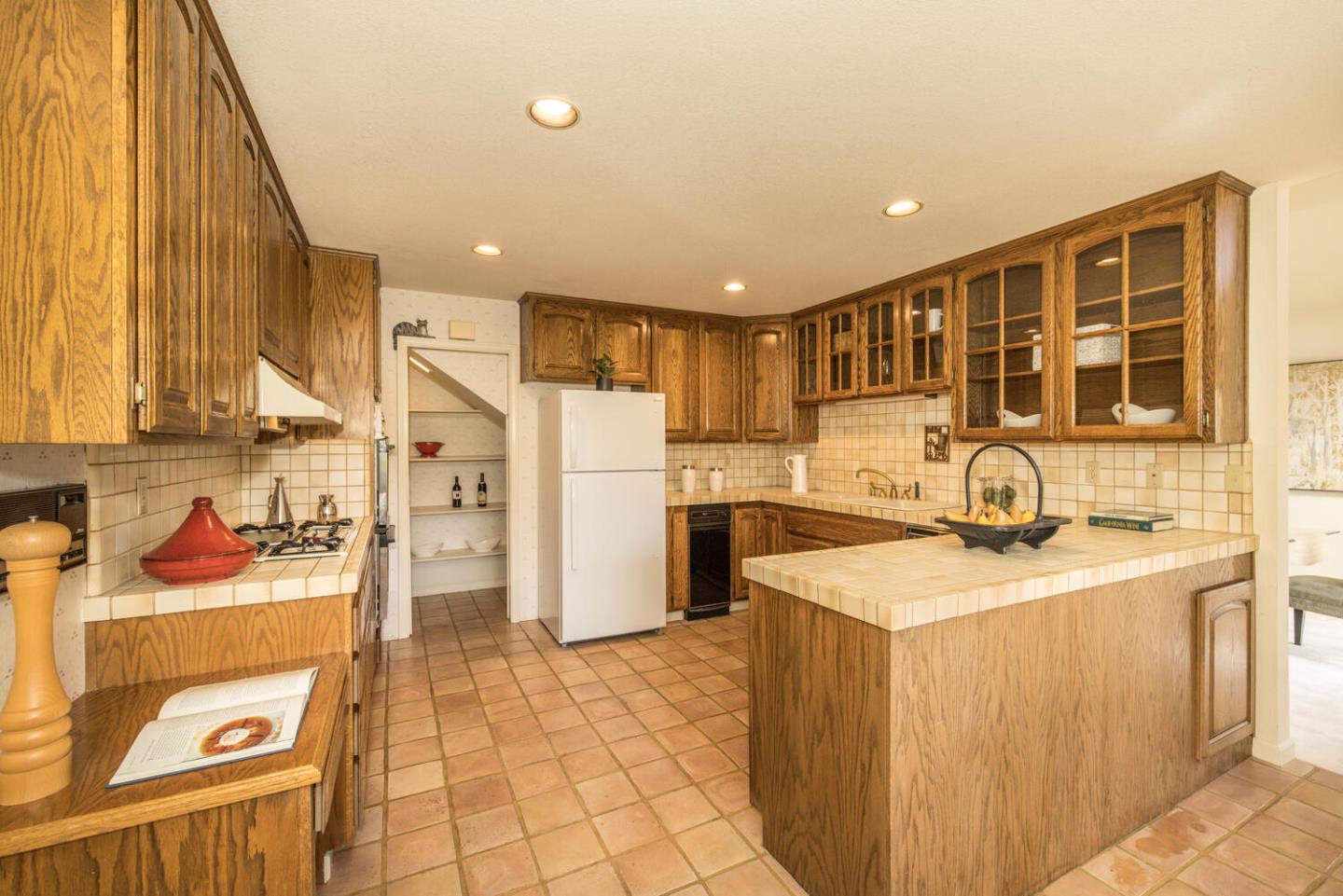 138 Cypress Point Road Half Moon Bay, CA 94019 - Photo 38 of 64 a kitchen with stainless steel appliances granite countertop a sink stove and refrigerator