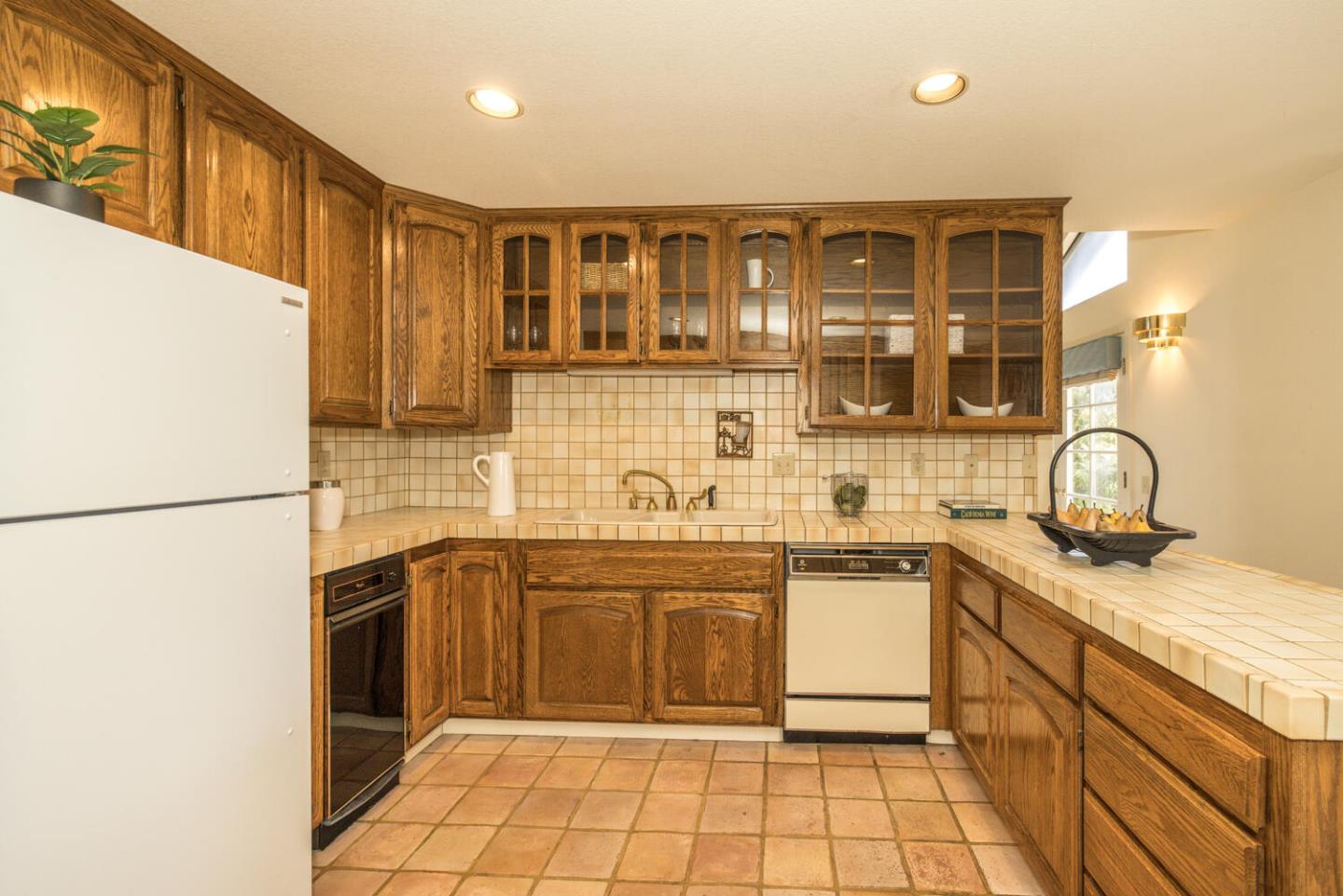 138 Cypress Point Road Half Moon Bay, CA 94019 - Photo 39 of 64 a kitchen with stainless steel appliances granite countertop a sink and cabinets