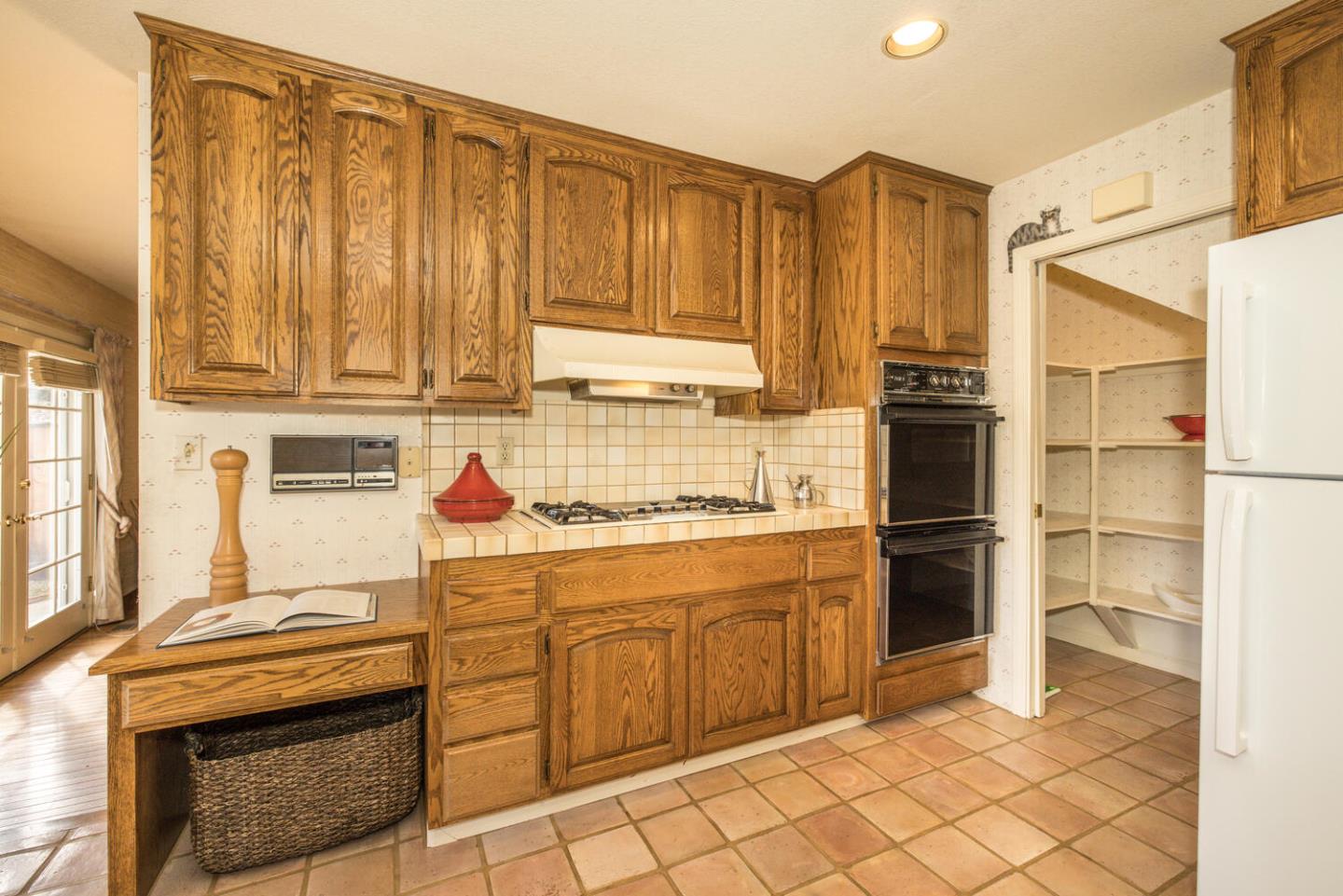138 Cypress Point Road Half Moon Bay, CA 94019 - Photo 40 of 64 a kitchen with stainless steel appliances granite countertop a refrigerator and a stove top oven