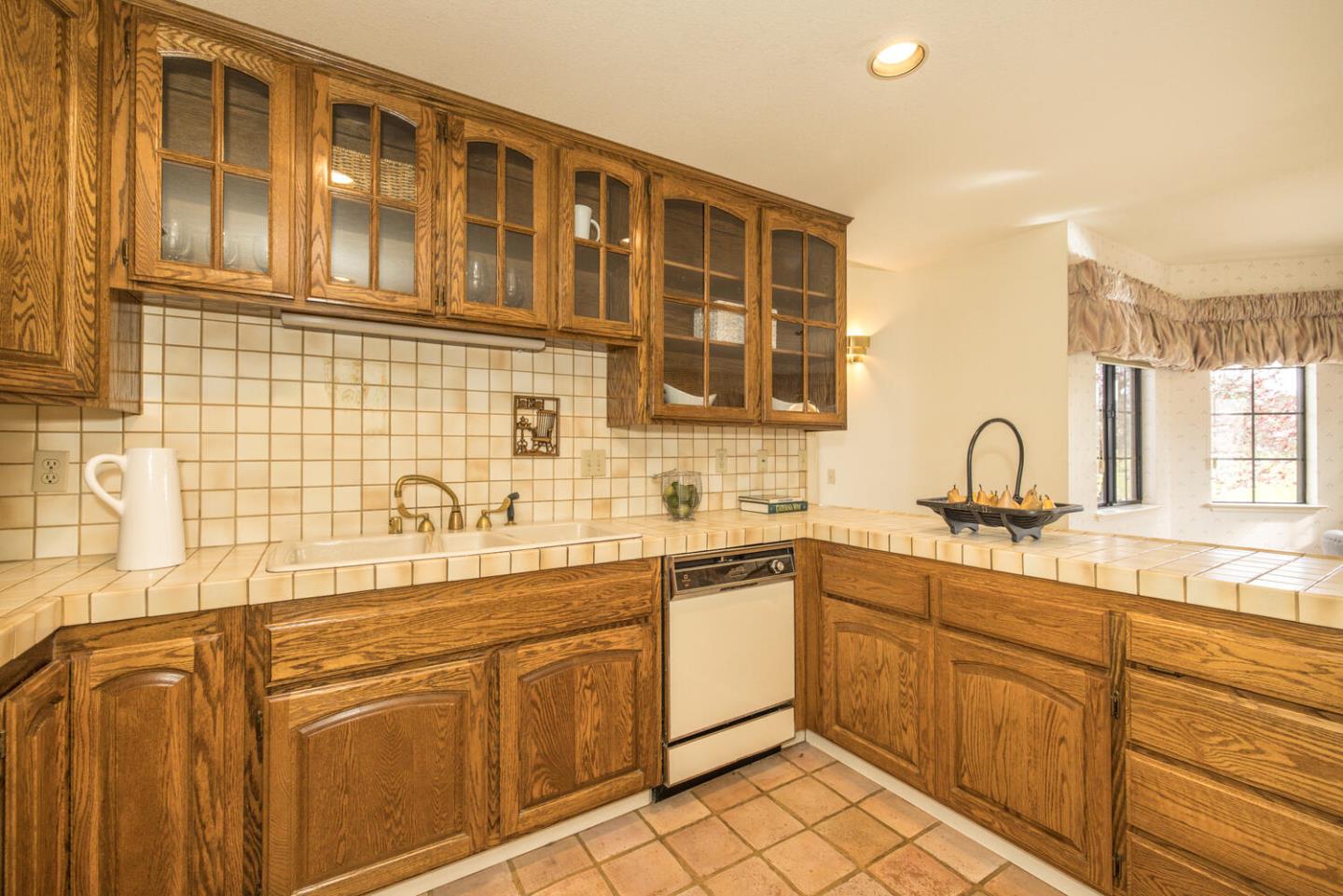 138 Cypress Point Road Half Moon Bay, CA 94019 - Photo 41 of 64 a kitchen with stainless steel appliances granite countertop a sink dishwasher stove and cabinets