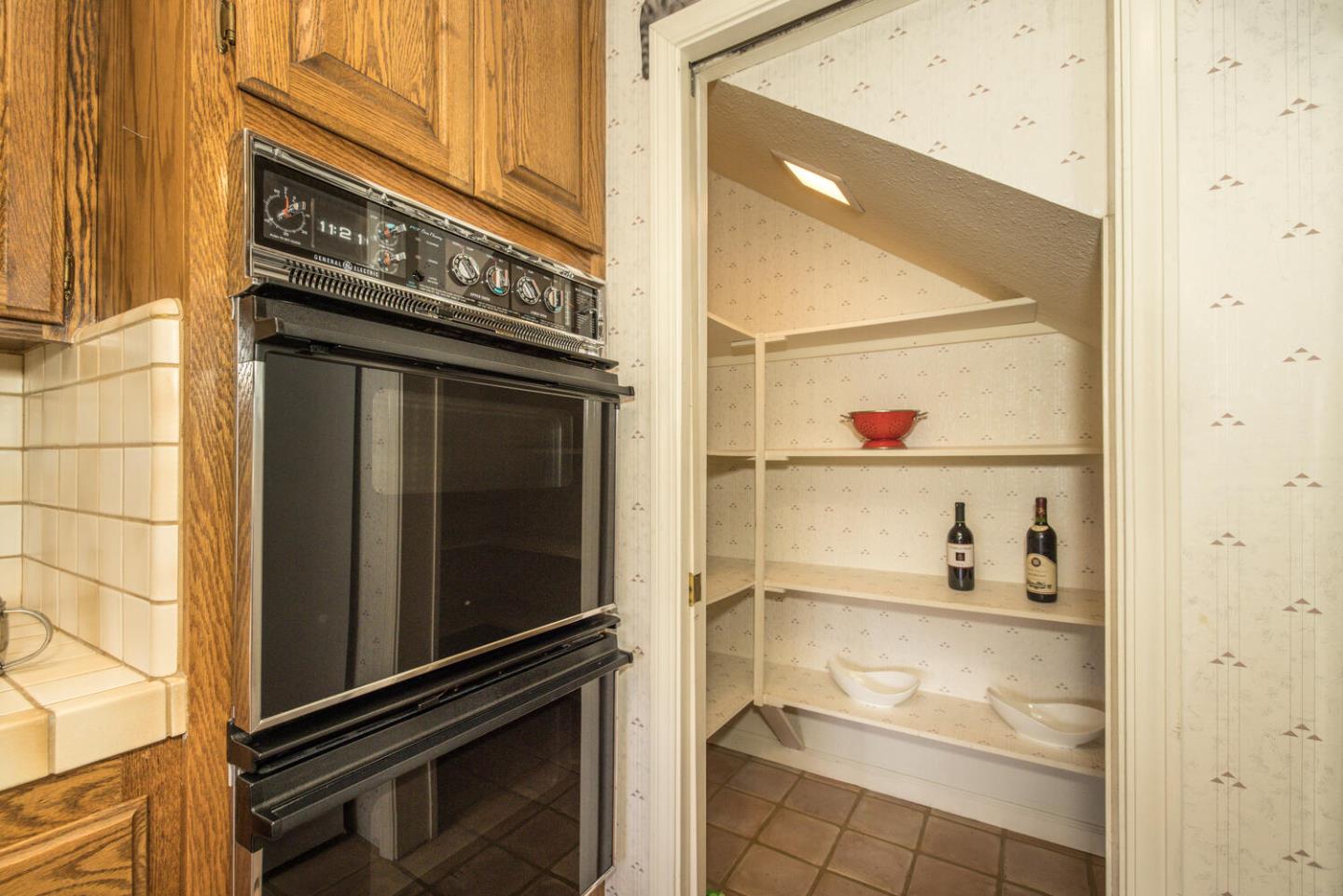 138 Cypress Point Road Half Moon Bay, CA 94019 - Photo 42 of 64 a refrigerator freezer sitting inside of a kitchen