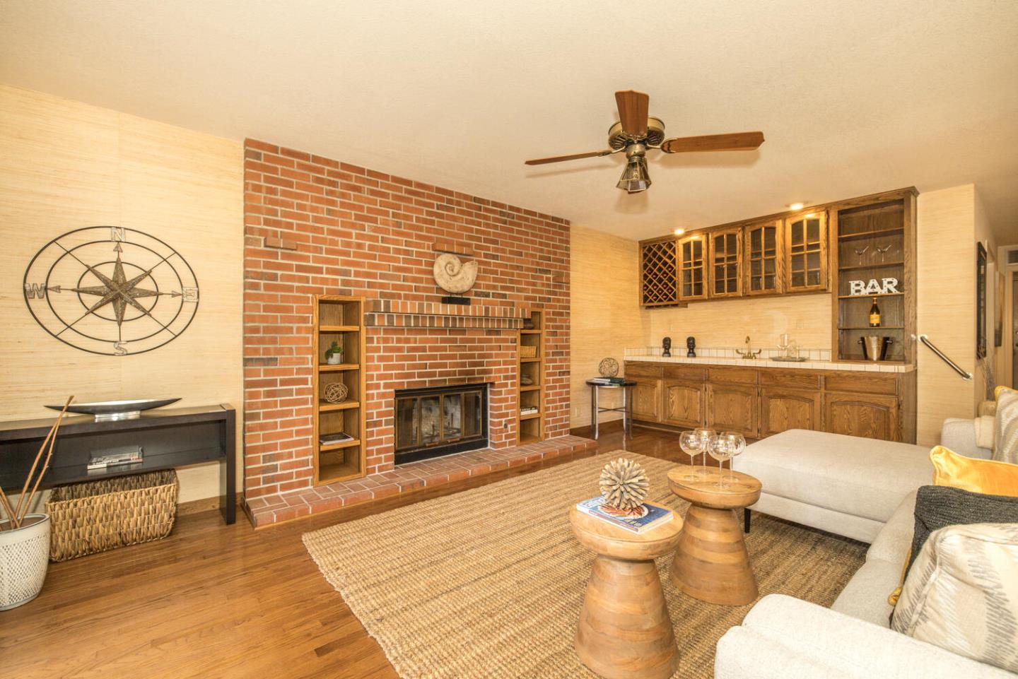 138 Cypress Point Road Half Moon Bay, CA 94019 - Photo 43 of 64 a living room with furniture and a fireplace