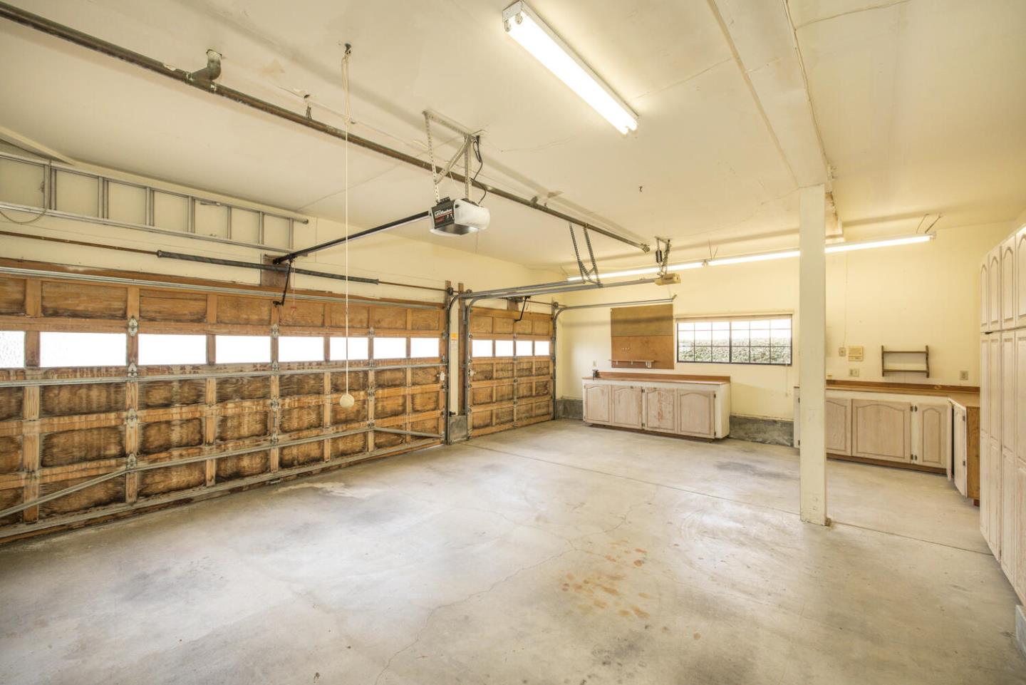138 Cypress Point Road Half Moon Bay, CA 94019 - Photo 45 of 64 a view of a garage with wooden table and chairs