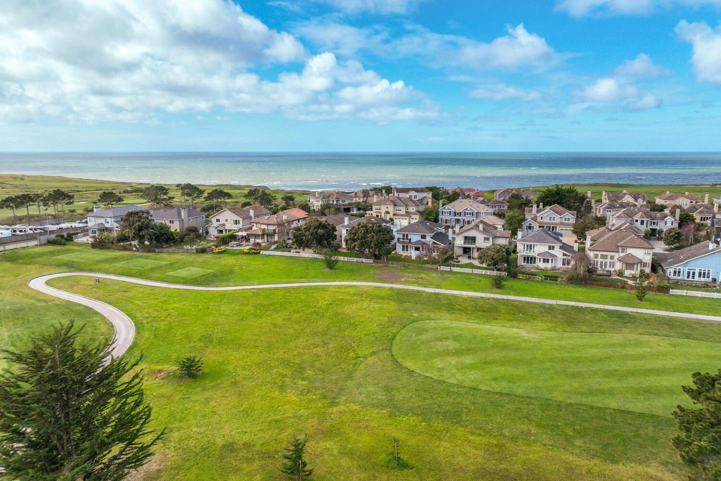 138 Cypress Point Road Half Moon Bay, CA 94019 - Photo 54 of 64 a view of a golf course with a big yard
