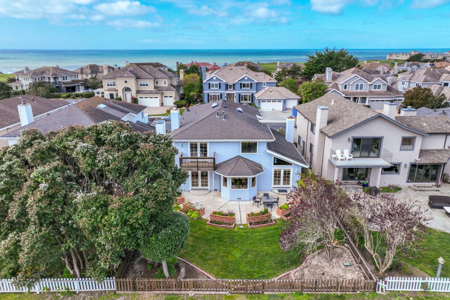 138 Cypress Point Road Half Moon Bay, CA 94019 - Photo 55 of 64 an aerial view of residential houses with outdoor space and trees