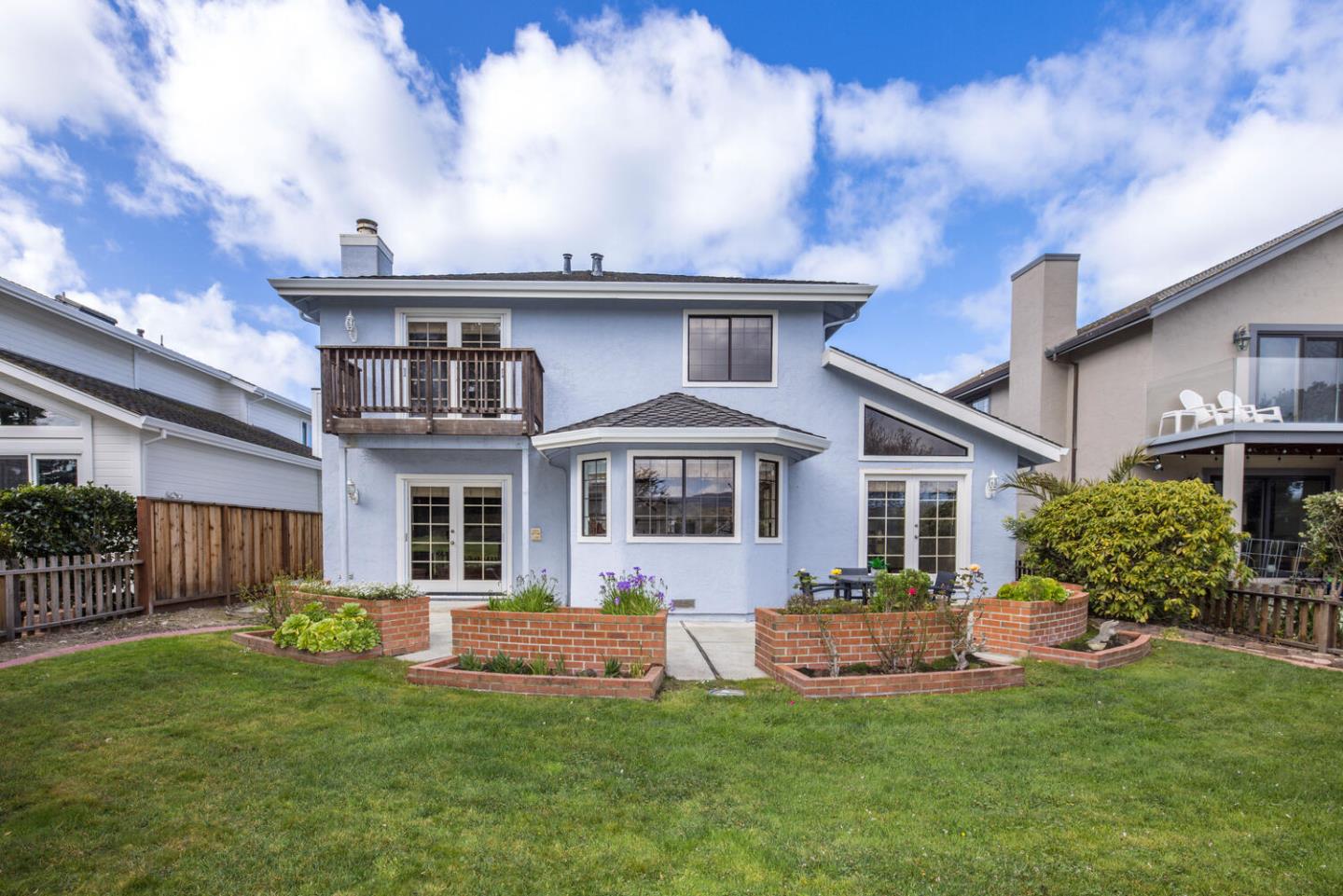 138 Cypress Point Road Half Moon Bay, CA 94019 - Photo 62 of 64 a front view of a house with a garden and yard