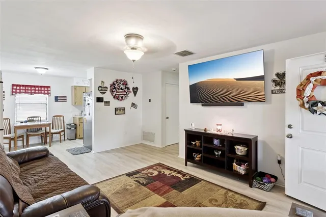 a living room with furniture and a rug