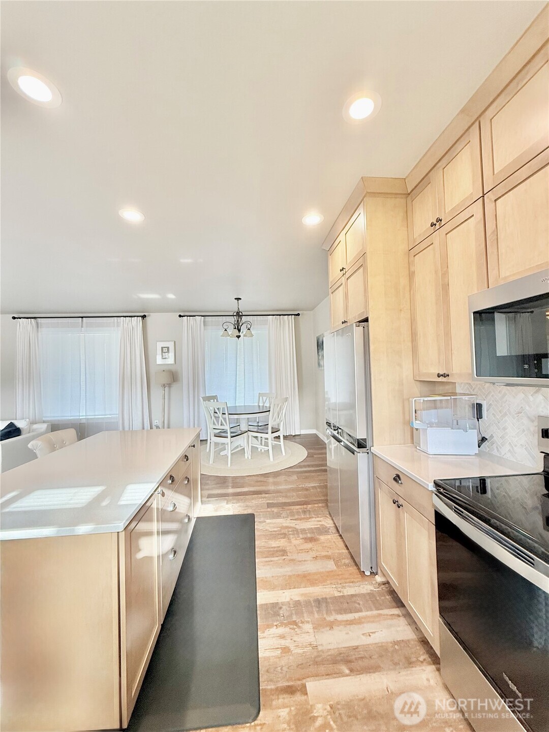 103 Johnson Creek Road Omak, WA 98841 - Photo 22 of 40 a large white kitchen with a large window