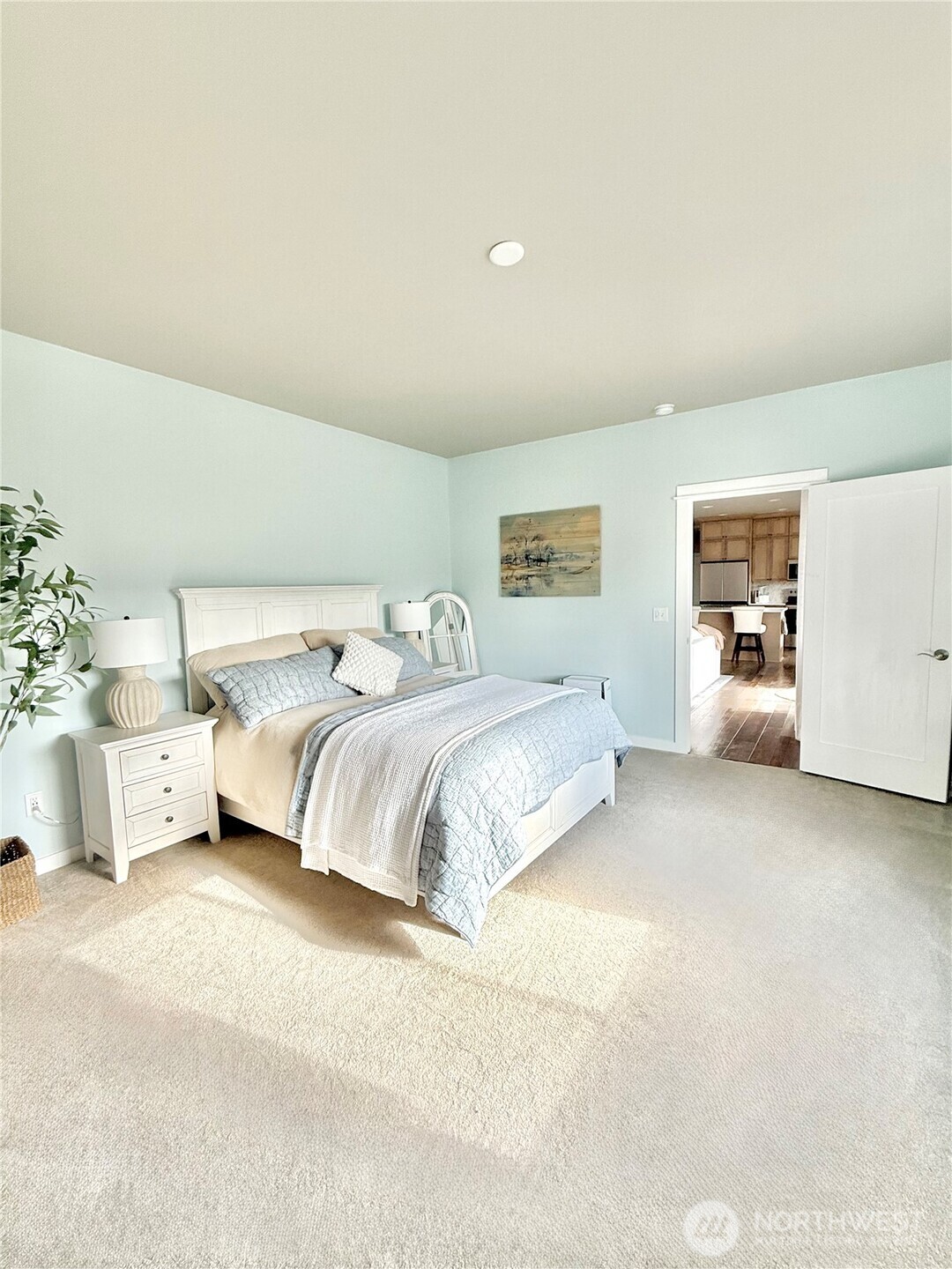 103 Johnson Creek Road Omak, WA 98841 - Photo 25 of 40 a bedroom with a bed and white cabinets