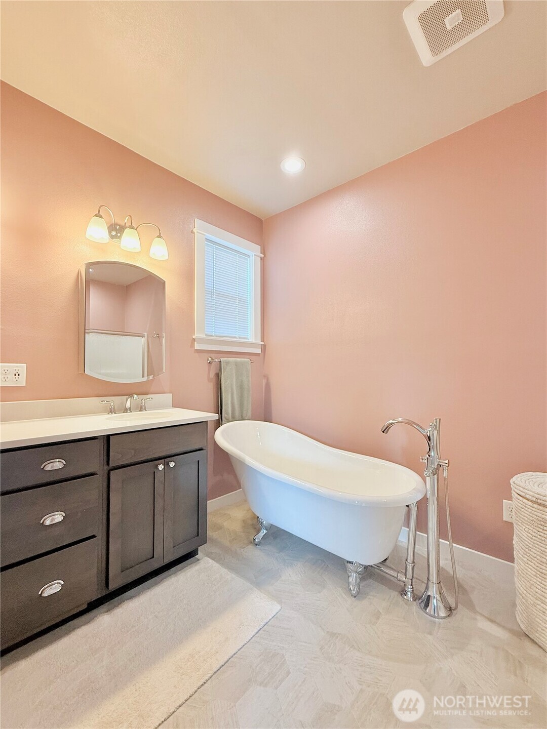 103 Johnson Creek Road Omak, WA 98841 - Photo 29 of 40 a spacious bathroom with a double vanity sink a mirror and a toilet