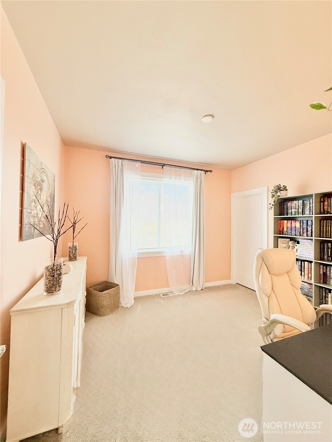 103 Johnson Creek Road Omak, WA 98841 - Photo 35 of 40 a living room with furniture and a book shelf