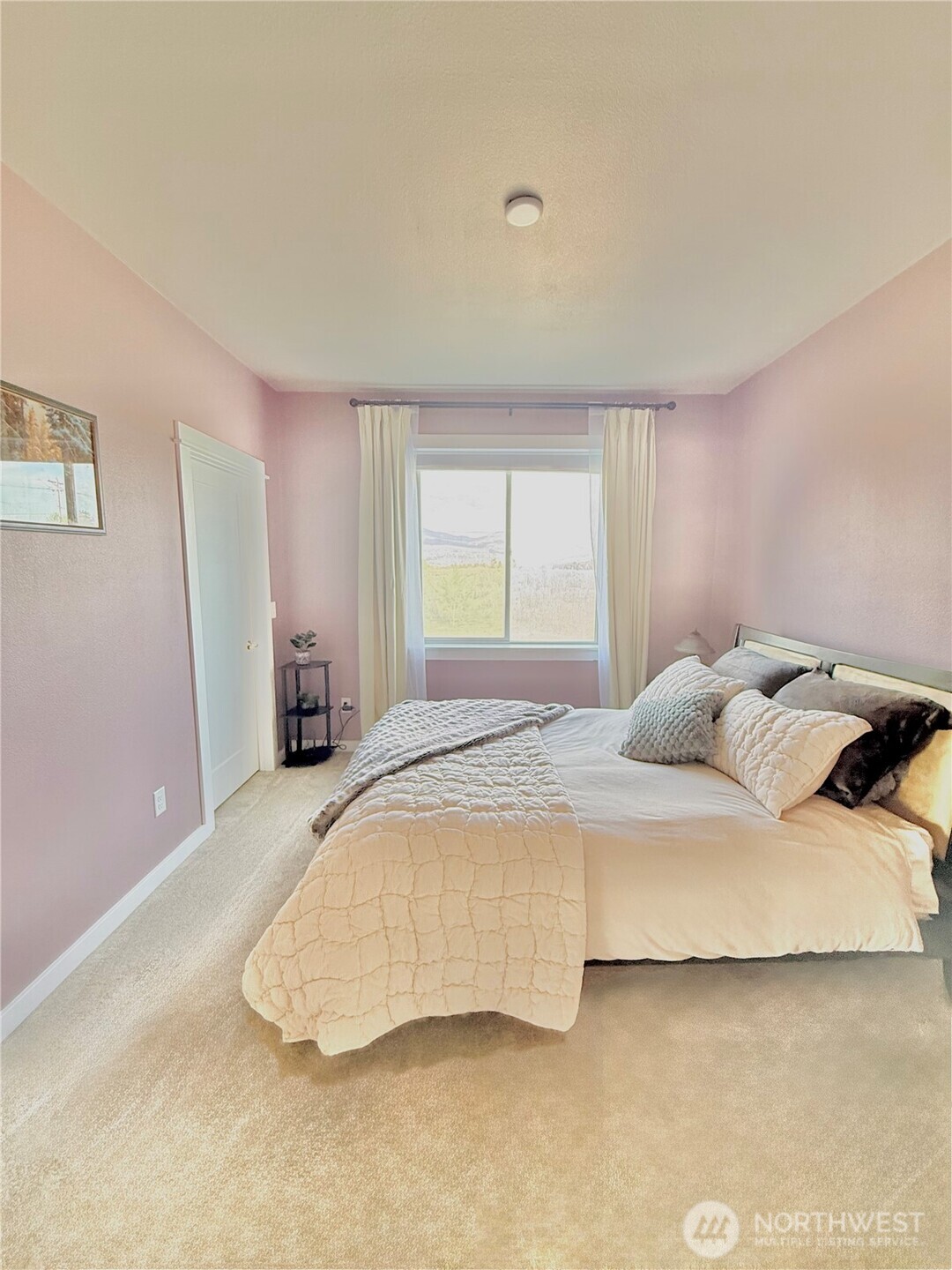 103 Johnson Creek Road Omak, WA 98841 - Photo 39 of 40 a bedroom with a bed and a couch