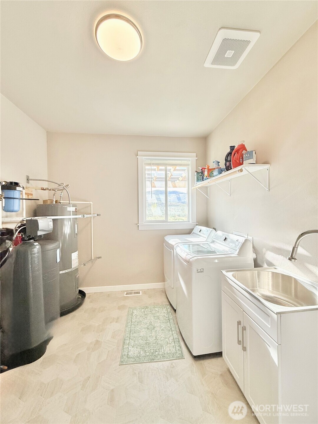 103 Johnson Creek Road Omak, WA 98841 - Photo 40 of 40 a storage utility room with a sink