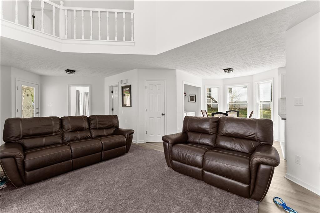 322 Wyngate Road Auburn, GA 30011 - Photo 12 of 44 a living room with furniture window and a couch