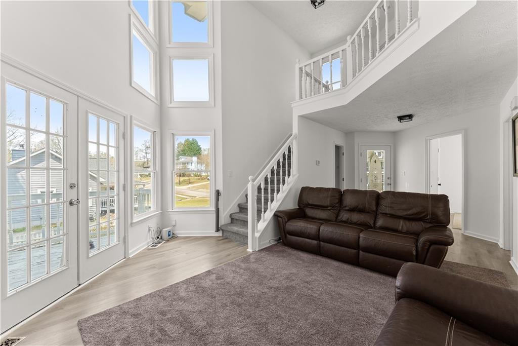 322 Wyngate Road Auburn, GA 30011 - Photo 13 of 44 a living room with furniture and a large window