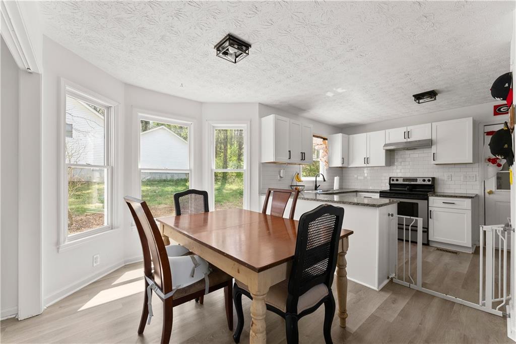 322 Wyngate Road Auburn, GA 30011 - Photo 14 of 44 a dining room with furniture and window