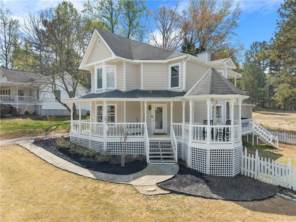 322 Wyngate Road Auburn, GA 30011 - Photo 2 of 44 a front view of a house with a garden