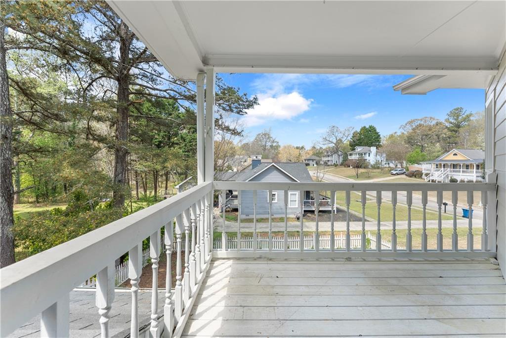 322 Wyngate Road Auburn, GA 30011 - Photo 29 of 44 a view of a balcony with wooden floor and city view