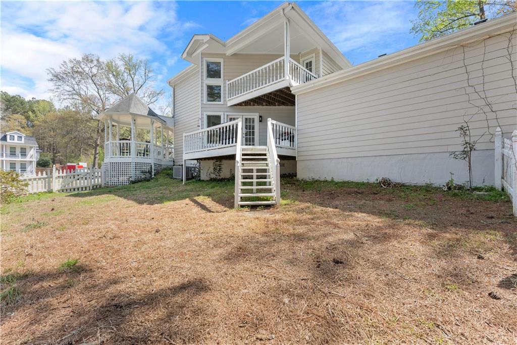 322 Wyngate Road Auburn, GA 30011 - Photo 35 of 44 a view of a house with a yard