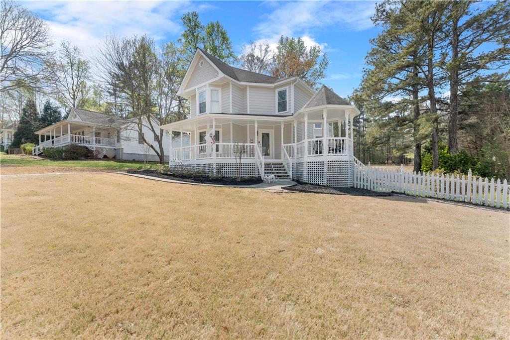 322 Wyngate Road Auburn, GA 30011 - Photo 5 of 44 a view of a house with a yard