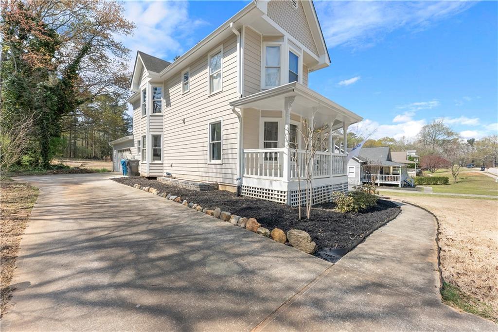 322 Wyngate Road Auburn, GA 30011 - Photo 6 of 44 a front view of a house with a yard