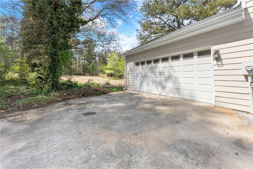 322 Wyngate Road Auburn, GA 30011 - Photo 7 of 44 a view of backyard with large trees