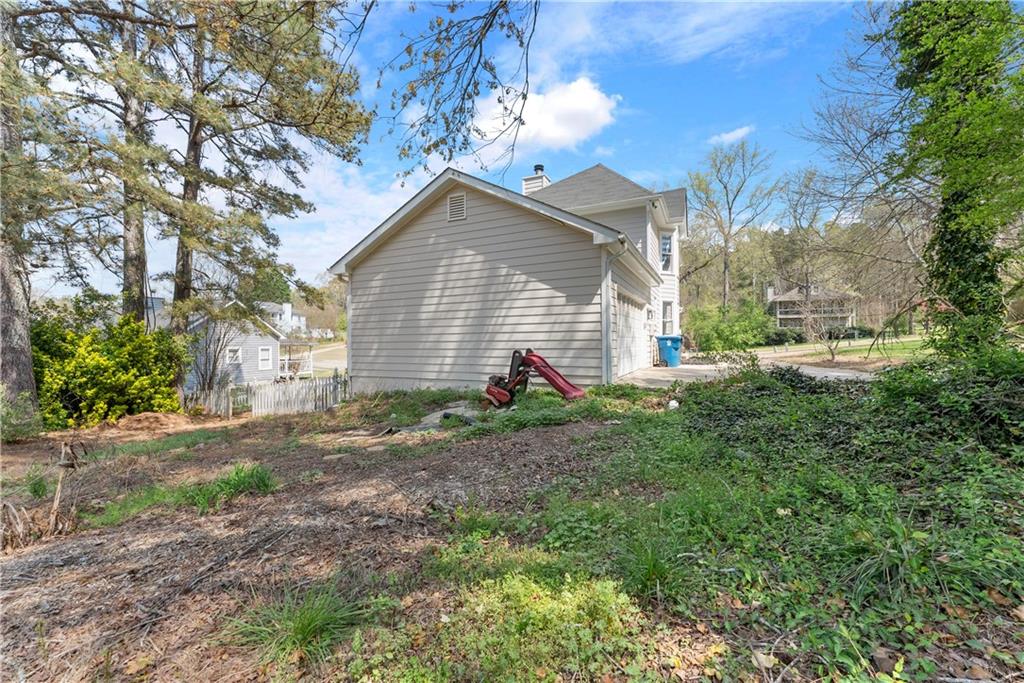 322 Wyngate Road Auburn, GA 30011 - Photo 8 of 44 a view of a house with yard and a tree
